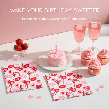 Pink lips and hearts paper napkins with birthday cake, cupcakes and sparkling drinks