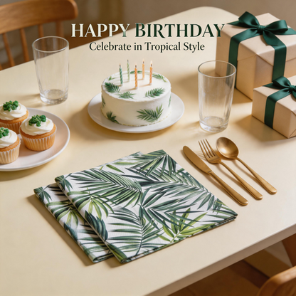 Tropical palm leaf paper napkins with birthday cake and green gift boxes